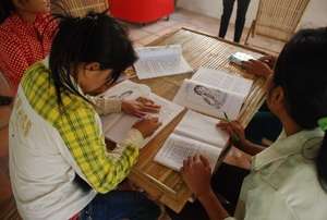 Karaoke bar workers attending a literacy class