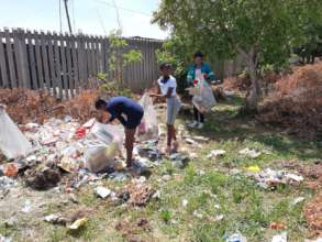 Cleanup of dumpsite to establish a garden