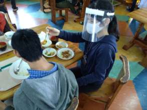 Meal service using the provided face shields