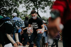 Distributing noodles and other basic necessities