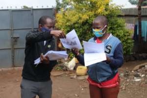 Teachers distributing Learning Packs