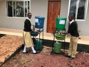 Mkonoo students using the tippy taps
