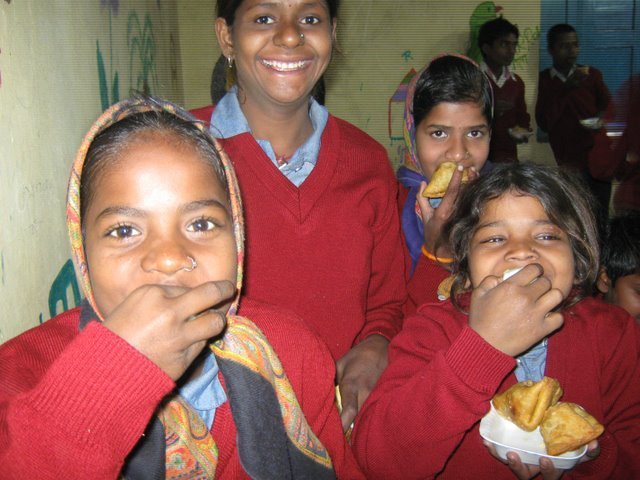 Girls enjoying food at the centre