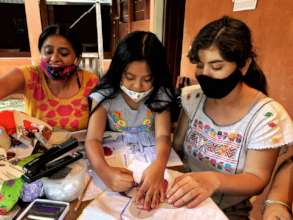 Chivis, Naba and Diana making sanitary towels