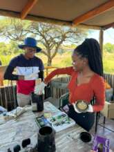 BUAN interns grinding dung samples into powder.