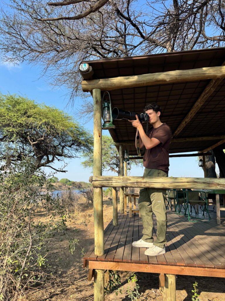From the camp deck, Arvid observes the elephants