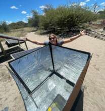 Imani with her solar oven