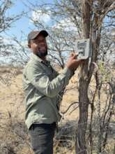 EfA Research Assistant deploying a camera trap