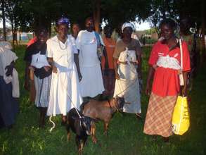 Members of the two groups after receiving goats