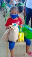 A child receives food, hygiene supplies and a toy!