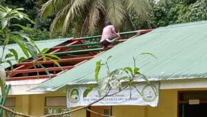 Repairing roof of Mukammali Elementary School