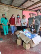 AAI Volunteers help sort supplies