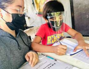 Teachers mentor students with full PPE gear