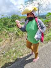 Recipient of COVID food relief in mountain Village