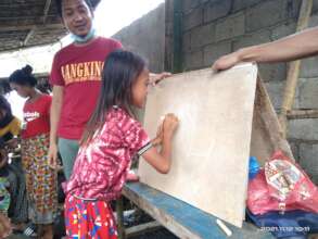 Learning to write at a Sulu outdoor learning camp