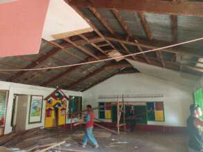 Parents repair classroom after typhoon damage