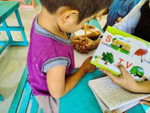 Sapie Reading Camp learning letters