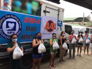 Mothers receive care packages for their families