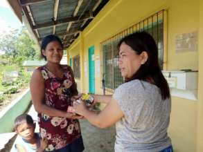 Teachers deliver AAI aid to parents at school
