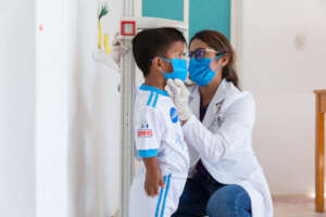Nutritionist performing anthropometric measurement