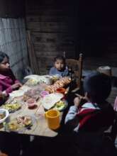 Families enjoying their dinner at home