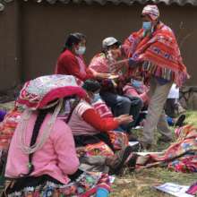 Llama farmers practicing hand disinfection steps.