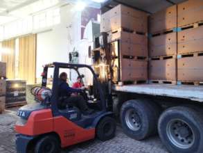 Unloading 32 tons of apples from Graaff fruit