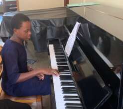 Atim plays the piano