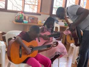 Children Exploring the Guitar