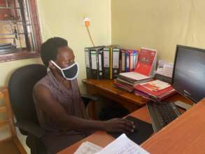 Christine working at the front desk