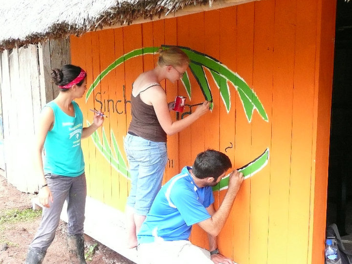 The volunteers painting the broom workshop
