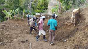 Community Members Working On The Road