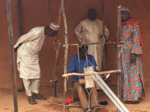 Setting up traditional looms for weaving school
