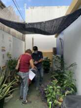 A participant receiving materials and pointers