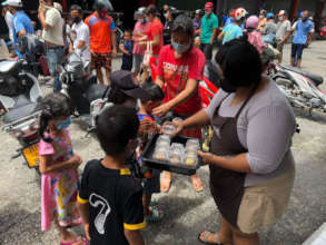 Giving out snacks to the hungry kids