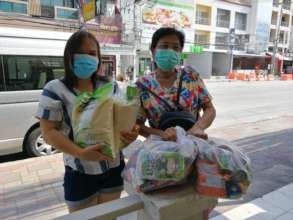 Women picking up Food