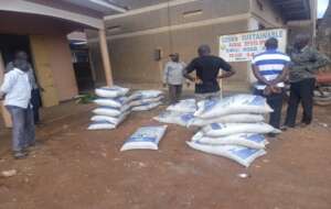 Farmers inspect coffee fertilzers at Cosma office