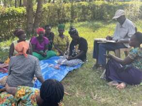 Dembe group at their weekly meeting