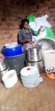 Florence next to her utensils for events hire