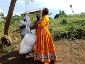 female farmer measuring her harvest