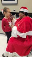 Mrs. Claus face painting child survivor - 2023