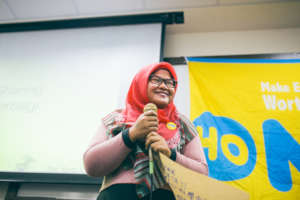 Migrant worker student sharing her business plan