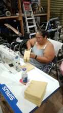 Laura using her new industrial sewing machine