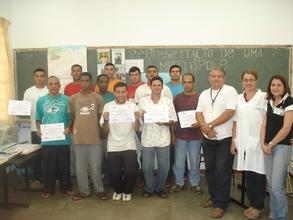 Two educators and some students who have graduated