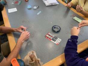 Students making braclets, learn about trafficking