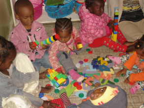 Annan and other children playing with toys