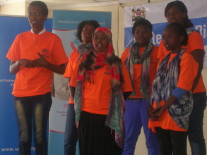 Sumaya reciting a poem during 16 days of activism.