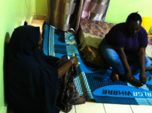 Fauzia (left) and Case worker during a home visit