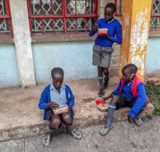 Gatoto students enjoy a meal