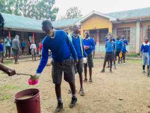 Gatoto students queue for food